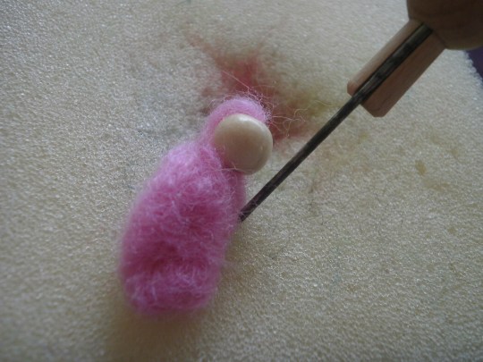 Needle felting to secure head and body.